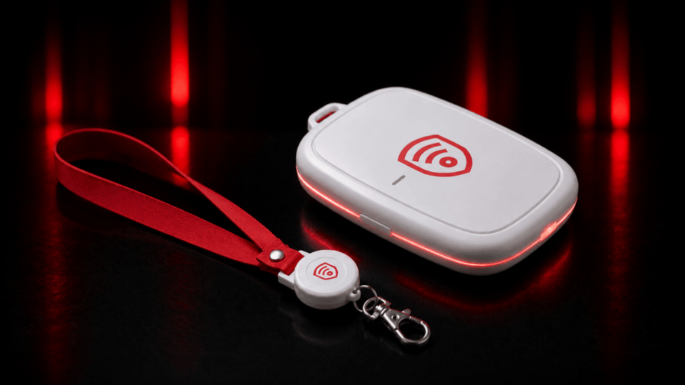 Guardiant Overwatch BLE activator with a red lanyard